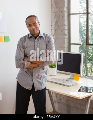 African American architect smiling in office Stock Photo