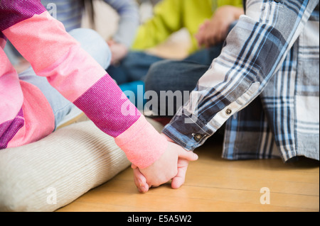 Close up of children holding hands Stock Photo