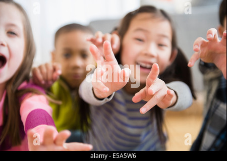 Children playing in living room Stock Photo