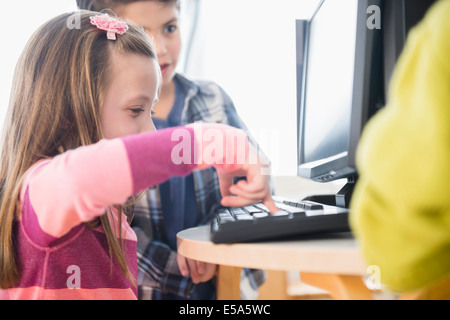 Children using computers in classroom Stock Photo