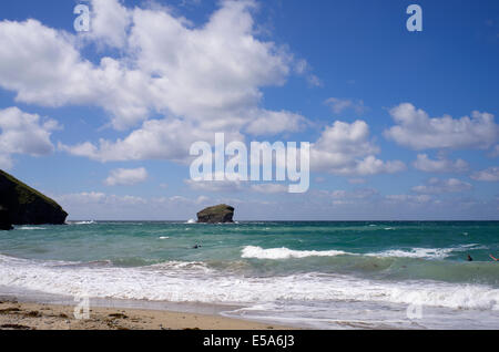 Portreath beach shore surf waves white clouds and big blue sky, Cornwall England. Stock Photo