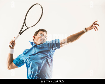 Caucasian man playing tennis Stock Photo