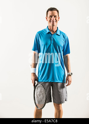 Caucasian tennis player smiling Stock Photo