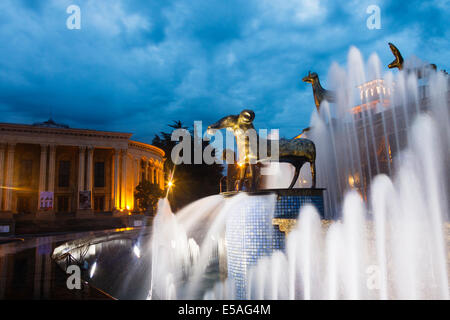 Illuminaed fountain with Golden Fleece statue and Theatre of Drama in background. Kutaisi, Georgia Stock Photo