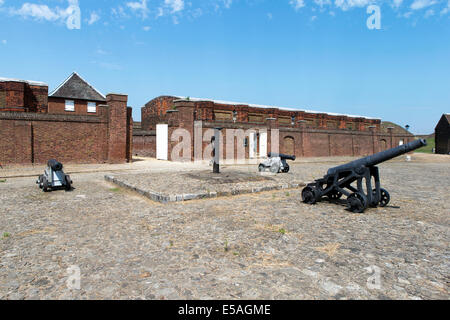 Cannon & Water pump on the parade ground in front of the Landport gate at Tilbury Fort, Essex, England, UK. Stock Photo