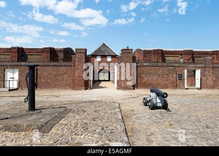 Cannon & Water pump on the parade ground in front of the Landport gate at Tilbury Fort, Essex, England, UK. Stock Photo