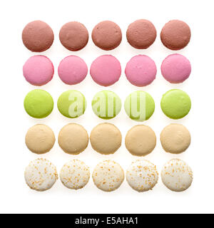 Food: multicolored macarons assortment, arranged in rows, isolated on white background Stock Photo