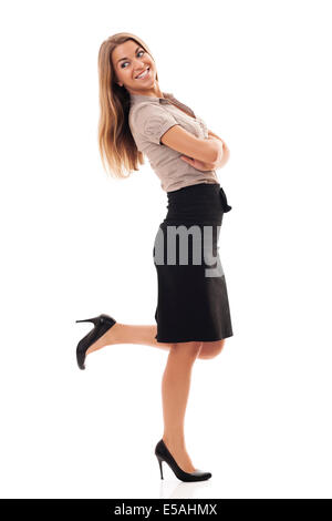 Successful businesswoman kicking up foot, Debica, Poland&#10; Stock Photo