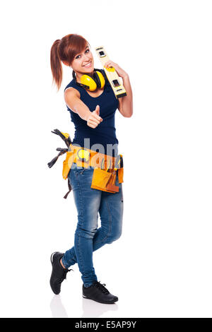 Young female construction worker showing OK sign, Debica, Poland Stock Photo