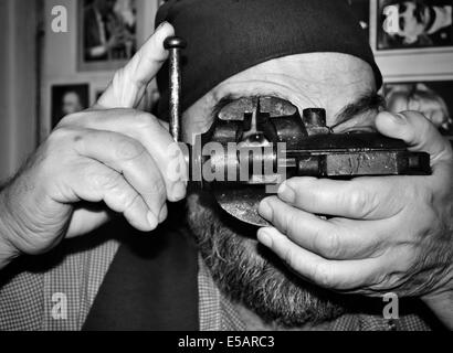 Ingenious photographer in front of his portrait portfolio BW Stock Photo