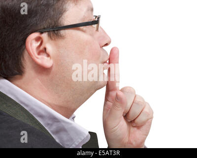 side view of businessman's finger near lips - silence hand gesture isolated on white background Stock Photo