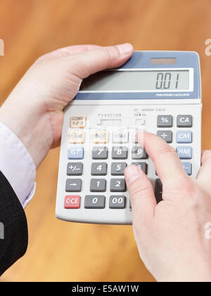 above view of calculator in businessman hands Stock Photo