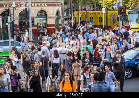 Melbourne Australia,Victoria CBD Central Business,District,Flinders Street,crossing,traffic,adult adults man men male,woman women female lady,Young & Stock Photo
