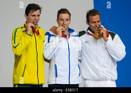 Glasgow, Scotland, UK. 25th July, 2014. Thomas Fraser-Holmes of Australia (silver), Daniel Wallace of Scotland (gold) and Sebastien Rousseau of South Africa (bronze) for the mens 400m Individual Medley during the swimming on day 2 of the 20th Commonwealth Games at Tollcross Swimming Centre on July 25, 2014 in Glasgow, Scotland. (Photo by Roger Sedres/Gallo Images/Alamy Live News) Stock Photo