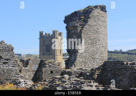 Aberystwyth castle featuring a broken tower with saint Michaels church behind Wales uk