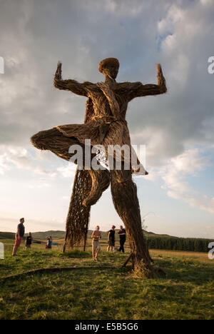 Dumfries, Scotland, UK. 25th July, 2014. Festival goers gather under the Wickerman on day one at Dundrennan on July 25, 2014 in Dumfries, United Kingdom. Credit:  Sam Kovak/Alamy Live News Stock Photo