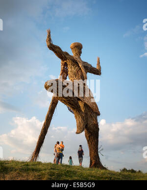 Dumfries, Scotland, UK. 25th July, 2014. Festival goers gather under the Wickerman on day one at Dundrennan on July 25, 2014 in Dumfries, United Kingdom. Credit:  Sam Kovak/Alamy Live News Stock Photo
