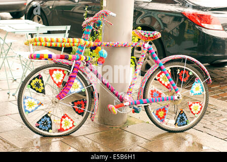 A bike covered in knitting or Yarn bombing in Hoylake Stock Photo