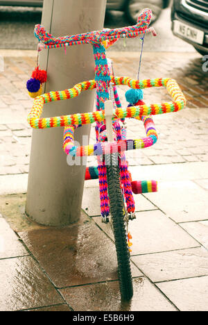 A bike covered in knitting or Yarn bombing in Hoylake Stock Photo