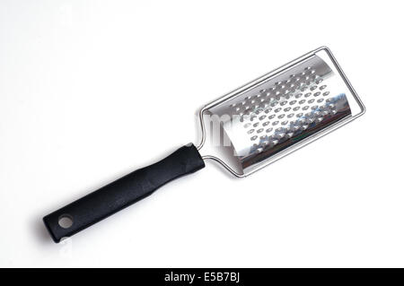 Zester of stainless steel in front of a white background Stock Photo
