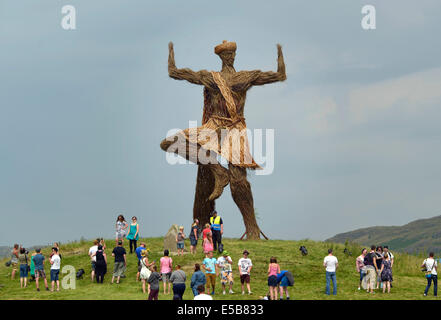 Dumfries, Scotland, UK. 25th July, 2014. Festival goers gather under the Wickerman on day two at Dundrennan on July 26, 2014 in Dumfries, United Kingdom. Credit:  Sam Kovak/Alamy Live News Stock Photo