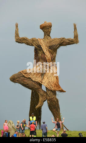 Dumfries, Scotland, UK. 25th July, 2014. Festival goers gather under the Wickerman on day two at Dundrennan on July 26, 2014 in Dumfries, United Kingdom. Credit:  Sam Kovak/Alamy Live News Stock Photo