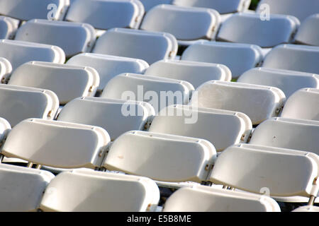 Row upon row of empty chairs waiting for the audience at a university graduation ceremony. Stock Photo