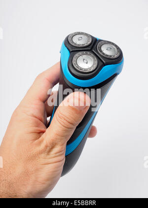 Man holding an electric shaver Stock Photo