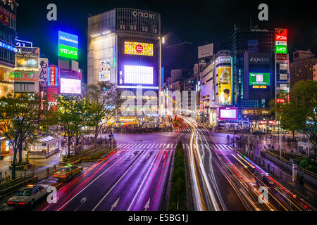 TOKYO, JAPAN - MARCH 30, 2014: Shibuya Ward at Shibuya crossing is one of Tokyo's major nightlife and fashion centers. Stock Photo