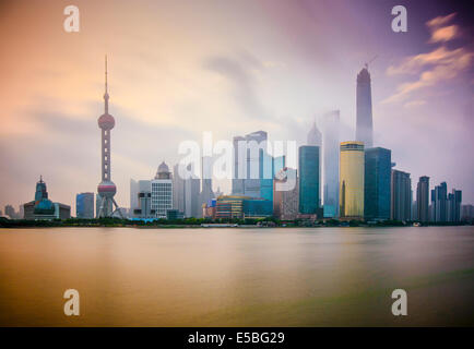 Shanghai, China cityscape viewed across the Huanpu River at dawn. Stock Photo