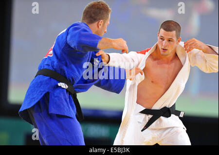 Glasgow, UK. 26th July, 2014. Dramatic scenes as Ryan Dill-Russell (NZL, blue) fights Gary Hall (ENG, white) for the bronze medal position in the Men's -90kg Judo Final of the XX Commonwealth Games. Gary Hall won. Credit:  Michael Preston/Alamy Live News Stock Photo