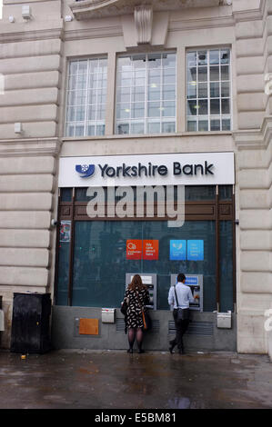 Yorkshire Bank with people at cash machines in London Stock Photo