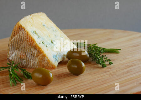 Cheese and Olives composition on wooden table Stock Photo