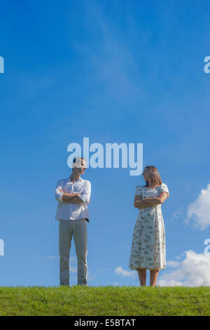 a couple with a conflict on a meadow Stock Photo