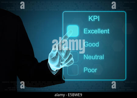business hand pushing KPI on a touch screen interface Stock Photo