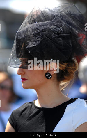 Vancouver, Canada. 26th July, 2014. A woman attends the 6th, annual Deighton Cup horse-racing derby in Vancouver, Canada, July 26, 2014. © Sergei Bachlakov/Xinhua/Alamy Live News Stock Photo