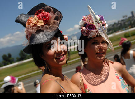 Vancouver, Canada. 26th July, 2014. Women attend the 6th, annual Deighton Cup horse-racing derby in Vancouver, Canada, July 26, 2014. © Sergei Bachlakov/Xinhua/Alamy Live News Stock Photo