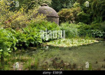 The Dovecote next to a pond in the gardens of Cotehele House nr Saltash Cornwall Stock Photo