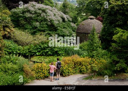 Visitors looking at the Dovecote in the gardens of Cotehele House nr Saltash Cornwall Stock Photo