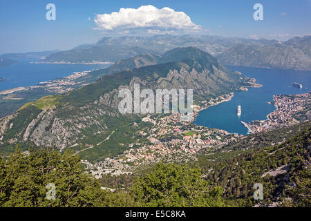 Aerial landscape & view looking down town & Bay of Kotor cruise ships Regal Princess & Celebrity Silhouette moored off shore Montenegro Adriatic Sea Stock Photo