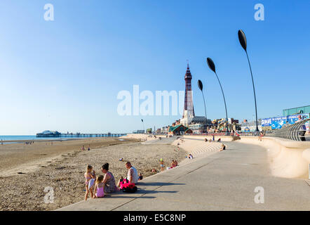 Beach and promenade in late afternoon looking towards North Pier and Blackpool Tower, The Golden Mile, Blackpool, Lancashire, UK Stock Photo