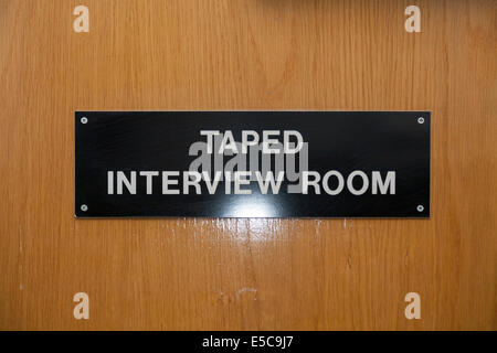Metropolitan Police Taped Interview Room sign in a Police station custody suite / suites / cell / cells in Twickenham. London UK Stock Photo