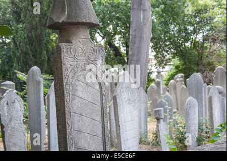 Old ornate islamic headstones in turkish graveyard Stock Photo