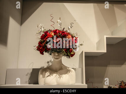 Close up showroom Victorian woman mannequin head wearing a unique red rose hat abstract, USA, United States, Victorian bouquet Easter bonnet Stock Photo