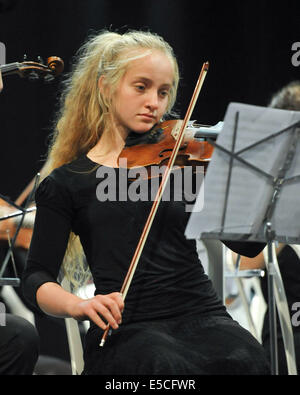 A young student performs solo at Eshkol Regional Council in a concert composed of students from 3rd grade to high school Stock Photo