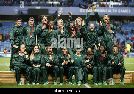 Glasgow, UK. 27th July, 2014. Team members of South Africa pose with the medals after the gold medal match of Men's Rugby Sevens during day 4 of the Glasgow 2014 Commonwealth Games at Ibrox Stadium in Glasgow, Scotland, Britain, on July 27, 2014. South African won the title by beating New Zealand in the gold medal match with 17-12. Credit:  Wang Lili/Xinhua/Alamy Live News Stock Photo