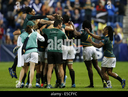 Glasgow, UK. 27th July, 2014. Team members of South Africa celebrate after the gold medal match of Men's Rugby Sevens during day 4 of the Glasgow 2014 Commonwealth Games at Ibrox Stadium in Glasgow, Scotland, Britain, on July 27, 2014. South African won the title by beating New Zealand in the gold medal match with 17-12. Credit:  Wang Lili/Xinhua/Alamy Live News Stock Photo