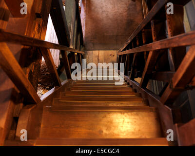 Old wooden staircase leading downstairs Stock Photo