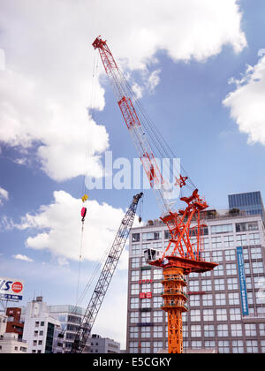Construction cranes in Shinjuku, Tokyo, Japan 2014 Stock Photo