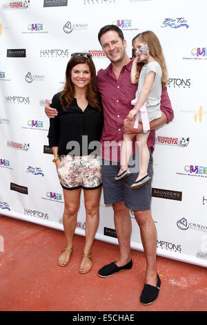 Tiffani Thiessen, husband Brady Smith and daughter Harper attend the 6th Annual Family Fair at the Children's Museum. Stock Photo